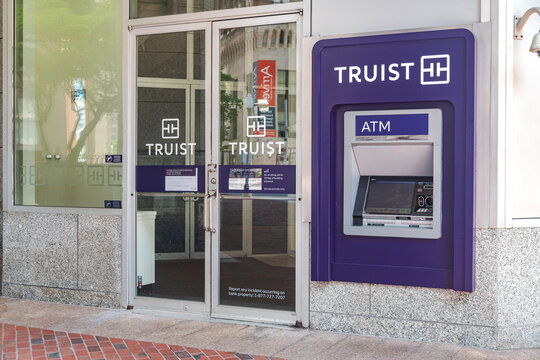 ATM and glass door at TRUIST Bank in Baltimore.