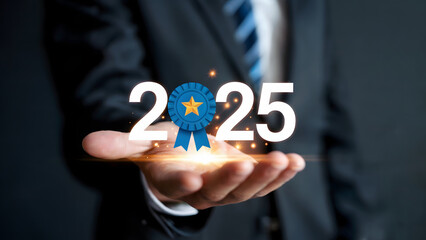 An executive presents the achievement of the year with a ribbon and the number 2025 displayed on an open hand, symbolizing business success and future goals.