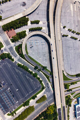 Complex highway system and urban parking lot on a sunny summer day