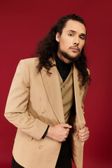 Charming young man showcases style with confidence against a vibrant backdrop