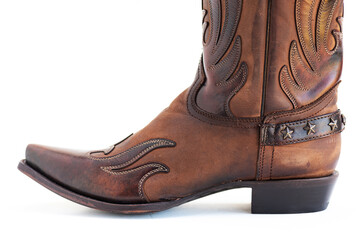 Vintage Style Cowboy Boot Close-Up. Textured leather with western scrollwork and star trim.