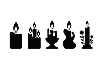 Obraz premium Black candle silhouettes with flames and decorative elements burning