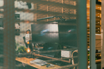 Modern cinematic desk setup with triple monitor, gaming chair, ambient light, and cozy atmosphere...