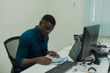 Black engineers are programming in an academic classroom for learning