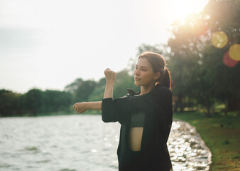 A woman getting ready to run and stretching, exercising before running.