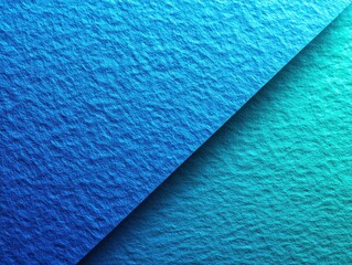 Abstract close-up of textured blue paper with a diagonal split and light-gradient effect.