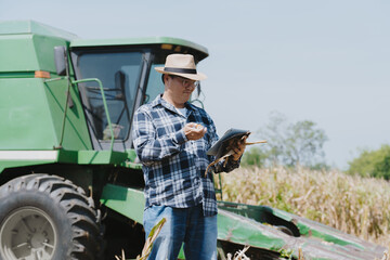 The owner of the corn field is analyzing the harvested corn.
