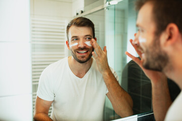 Guy doing the skincare routine in the morning