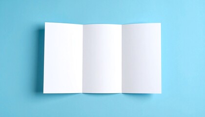 Blank tri-fold brochure on a blue background, ideal for customizable marketing materials