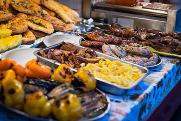 Street food meat vegetables salads on the counter