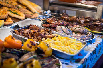 Street food meat vegetables salads on the counter
