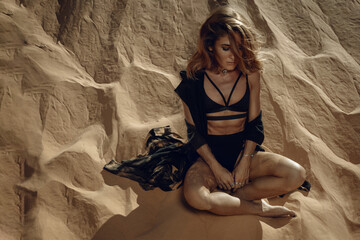 Stylish Woman in Black Bikini Posing on Sand Dune