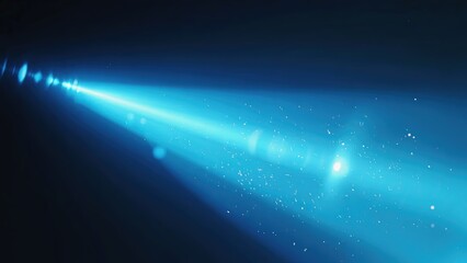Fototapeta premium Bright blue light beam cutting through darkness with particles suspended in the air