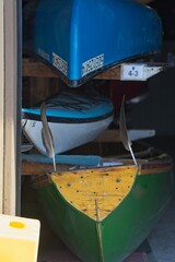 Colorful Boats in Garage with Feathers