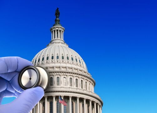 Fototapeta US Capitol building with doctors hand with stethoscope