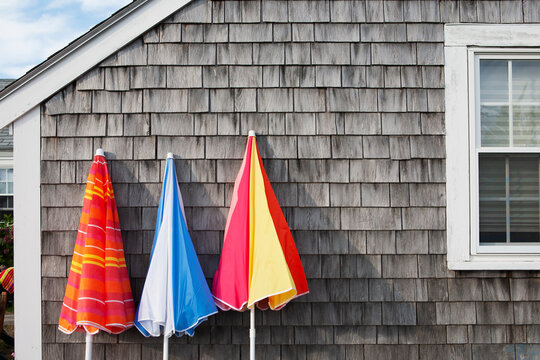 Folded beach umbrellas at beach cottage
