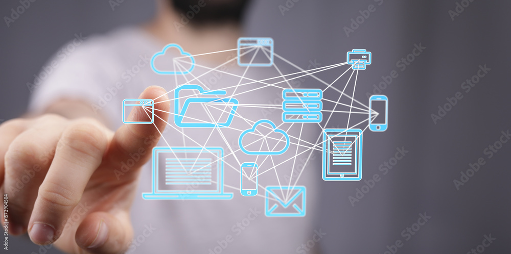 Poster man interacts with a digital network of connected devices, illustrating cloud computing and data sha