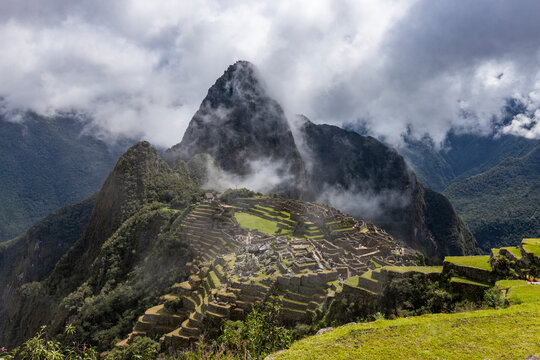 Clouds over Machu Picchu Inca ruins and mountains