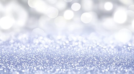 Shimmering silver glitter texture with blurred bokeh lights in the background