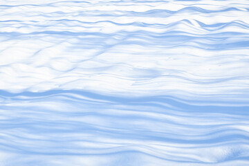 Fresh sparkling snow diagonal blue tone close-up, perfect as a winter season background or texture