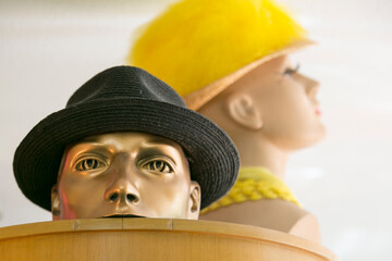 Hats on mannequins at vintage clothing shop