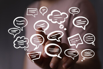 Abstract image of a hand interacting with digital speech bubbles, representing communication...