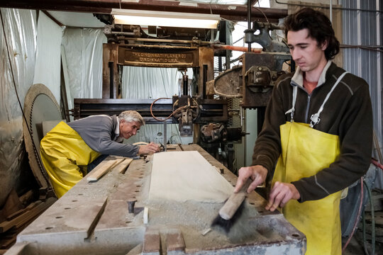 Father and son stone carvers at work