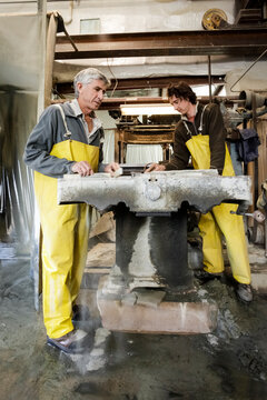 Father and son stone carvers at work