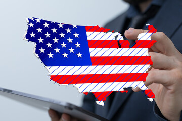 Image of a businessman holding a digital US map, representing growth and opportunity.