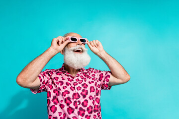 Photo of handsome bearded grandpa look impressed empty space dressed stylish pink leopard print...