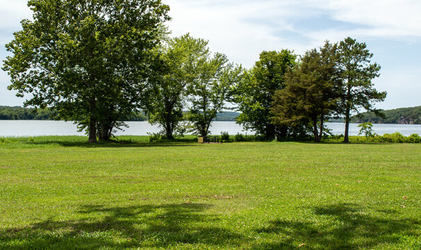Manicured lawn with lake background