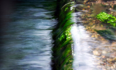 Clear silky flowing water close up