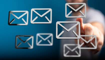 Close-up of a hand interacting with email icons, representing digital communication and inbox...
