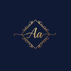 Elegant golden 'Aa' monogram logo, featuring stylish script letters beautifully encased within an ornate decorative frame on a deep blue background.