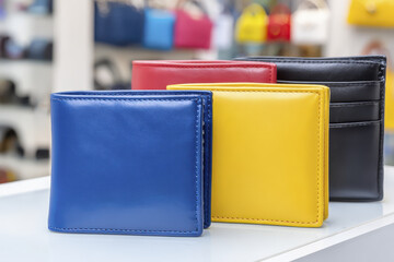 Colorful Variety of Leather Wallets Displayed in a Retail Boutique Setting with Vibrant Fashion Accessories