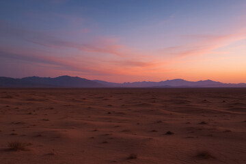 Desert landscape at twilight with purple and pink sky

Rolling sand dunes under a colorful sunset horizon