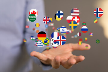 Image of hands holding various flags, symbolizing international business and global reach.