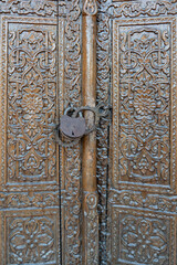 A decorative door with a lock on it at the Gur Amir Mausoleum in Samarkand, Uzbekistan