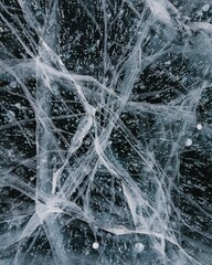 Cracked ice texture in a frozen lake.