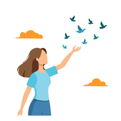 Fototapeta premium Woman releasing birds into the sky with clouds flying