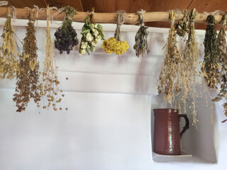 Traditional Russian hut with a stove and dried wild herbs. Horizontal photo of an old interior, 1820s, Mikhailovskoye village, Pushkin's nanny's house.