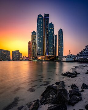 Sunset view of Etihad Towers in Abu Dhabi.