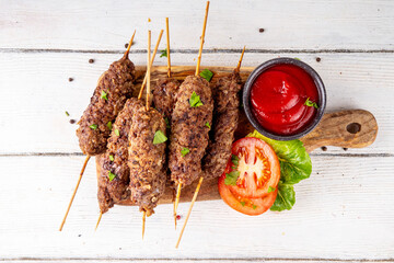 Shish kebab on stick, made from ground beef meat. Lula kebab, traditional Caucasian dish, with...