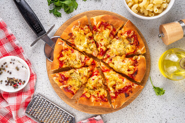 Viral Pizza Pasta, Nudelpizza, made with tomato sauce, macaroni and mozzarella. Unusual american...