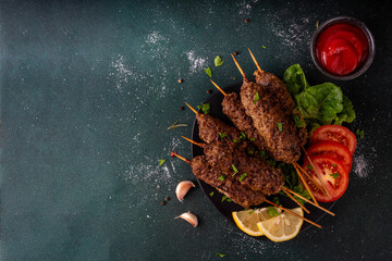 Shish kebab on stick, made from ground beef meat. Lula kebab, traditional Caucasian dish, with...