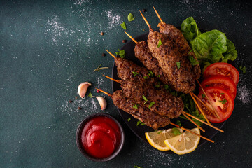 Shish kebab on stick, made from ground beef meat. Lula kebab, traditional Caucasian dish, with...