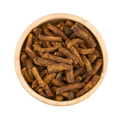 flat lay pile of dry dandelion root herb for loose tea in wood bowl cutout