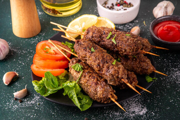 Shish kebab on stick, made from ground beef meat. Lula kebab, traditional Caucasian dish, with...