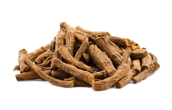 closeup pile of dry dandelion root herb for loose tea cutout