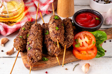 Shish kebab on stick, made from ground beef meat. Lula kebab, traditional Caucasian dish, with...